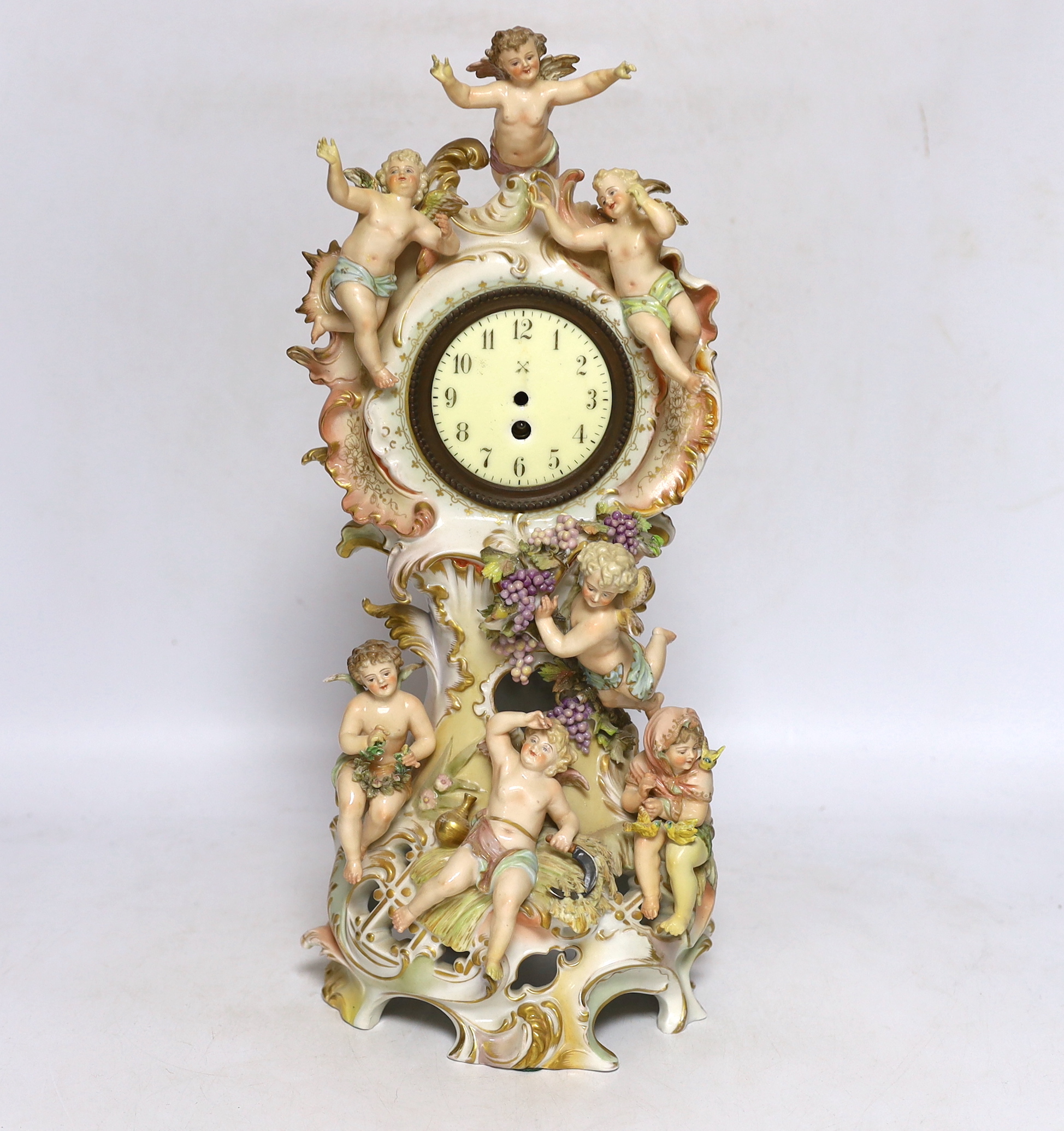A Continental porcelain figural mantel clock, no movement